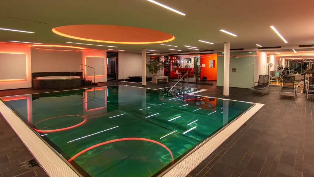 Wellnesshotel Hohenrodt, wellness pool area with indoor pool and whirlpool, equipped with atmospheric ambient lighting for a relaxing atmosphere