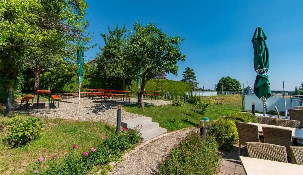 Outdoor area of the Wellnesshotel Hohenrodt with beer garden and terrace in natural surroundings