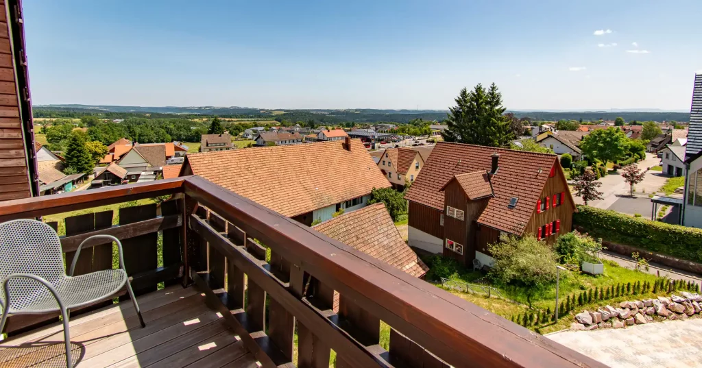 Balcony of Apartment 36 at Wellness Hotel Hohenrodt in the Black Forest, featuring a cozy seating area and a stunning view for relaxing moments outdoorsBalkon des Apartments 36 im Wellnesshotel Hohenrodt im Schwarzwald mit gemütlichem Sitzbereich und herrlichem Ausblick für erholsame Momente im Freien